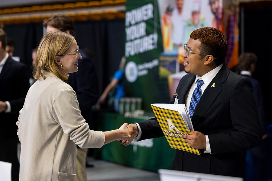 WCOB student talking with employer